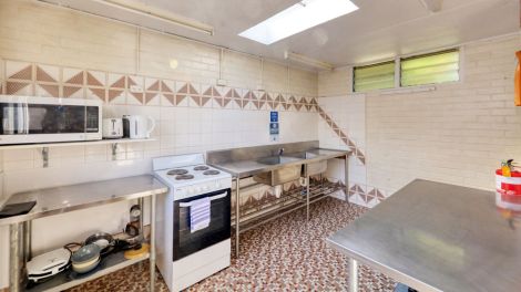 The fully equipped modern camp kitchen at Eden Gateway Holiday Park
